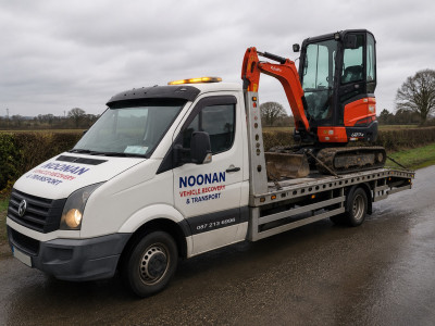 Noonan Vehicle Recovery & Transport transporting a mini digger in Ireland Noonan Vehicle Recovery & Transport transporting a mini digger in Ireland
